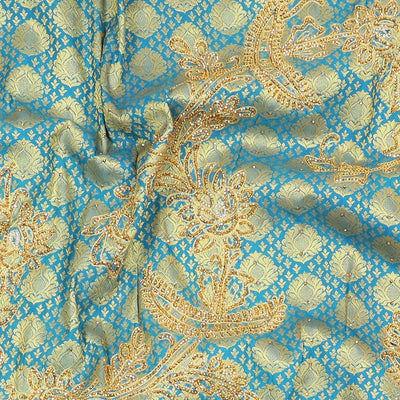 Blue embossed silksaree with stonework, contrast cutwork border & rich stonework pallu & unstitched aari blouse