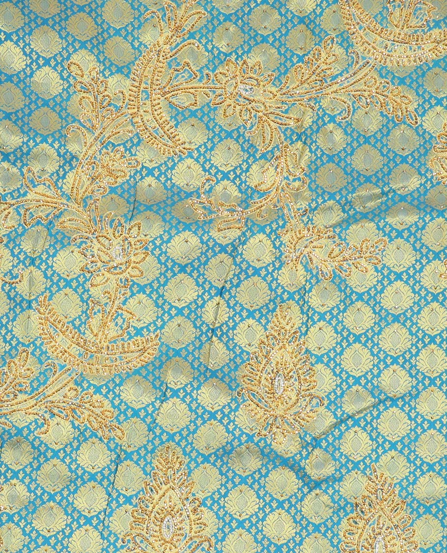 Blue embossed silksaree with stonework, contrast cutwork border & rich stonework pallu & unstitched aari blouse