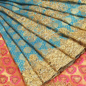Blue embossed silksaree with stonework, contrast cutwork border & rich stonework pallu & unstitched aari blouse