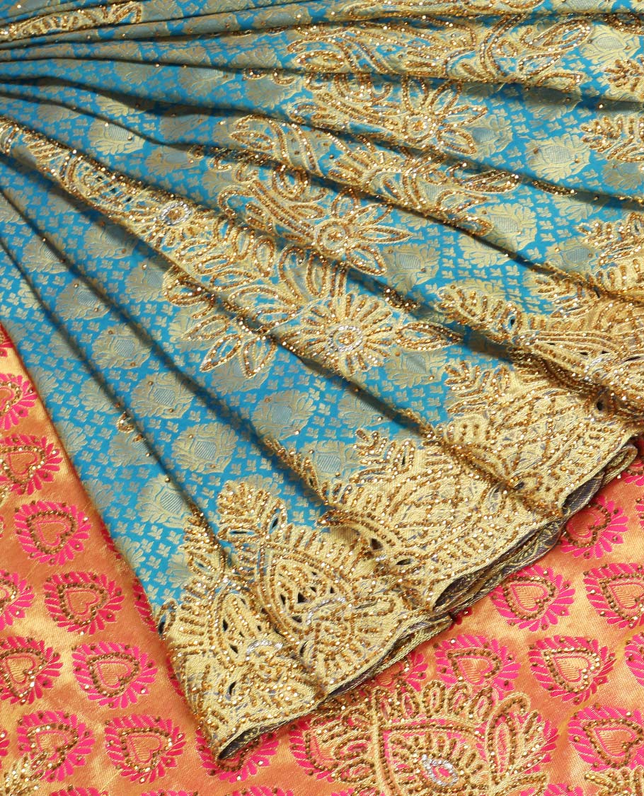Blue embossed silksaree with stonework, contrast cutwork border & rich stonework pallu & unstitched aari blouse