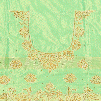 Green silk saree of ogee design with stonework, self curve border of peacock design & grand pallu embedded with stones