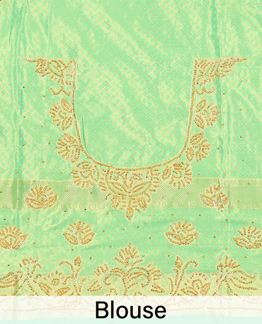 Green silk saree of ogee design with stonework, self curve border of peacock design & grand pallu embedded with stones