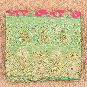Hot pink silksaree with floral & paisley jacquard design, contrast turquoise cut work border & pallu, all-over stonework