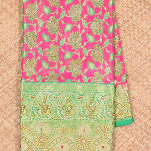 Hot pink silksaree with floral & paisley jacquard design, contrast turquoise cut work border & pallu, all-over stonework