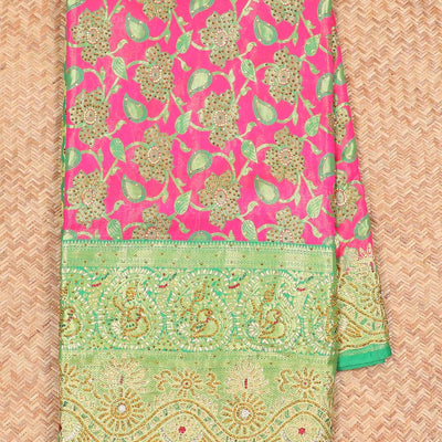 Hot pink silksaree with floral & paisley jacquard design, contrast turquoise cut work border & pallu, all-over stonework