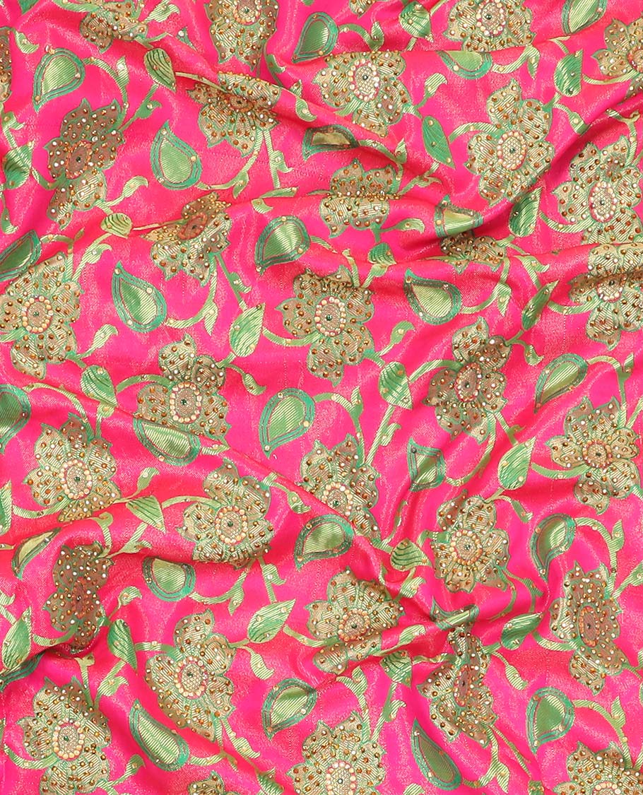 Hot pink silksaree with floral & paisley jacquard design, contrast turquoise cut work border & pallu, all-over stonework