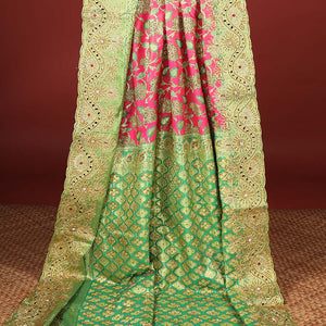 Hot pink silksaree with floral & paisley jacquard design, contrast turquoise cut work border & pallu, all-over stonework