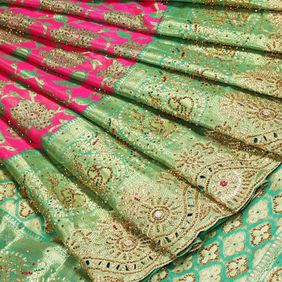 Hot pink silksaree with floral & paisley jacquard design, contrast turquoise cut work border & pallu, all-over stonework