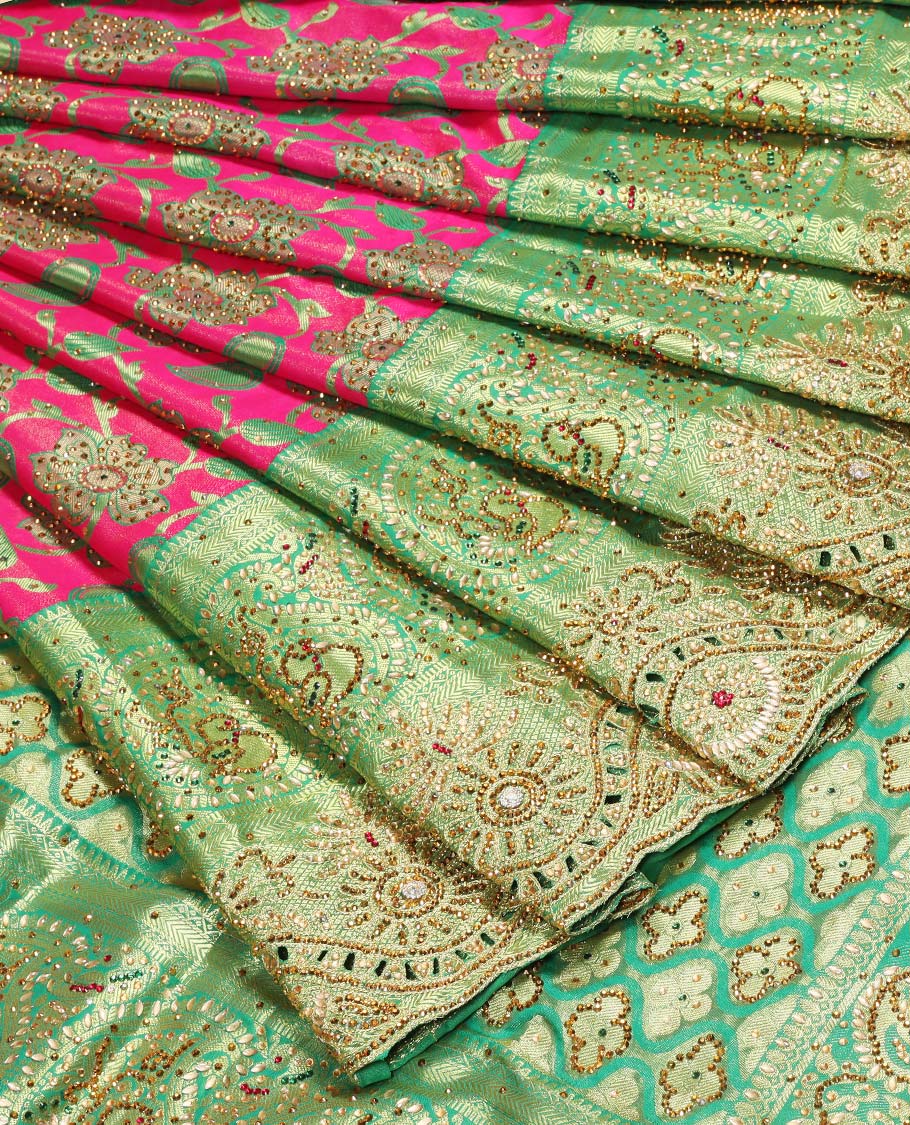 Hot pink silksaree with floral & paisley jacquard design, contrast turquoise cut work border & pallu, all-over stonework