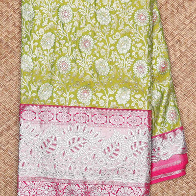 Leaf green silksaree with floral-jaal jacquard, contrast cut work border & pallu of argyle design, all-over stonework