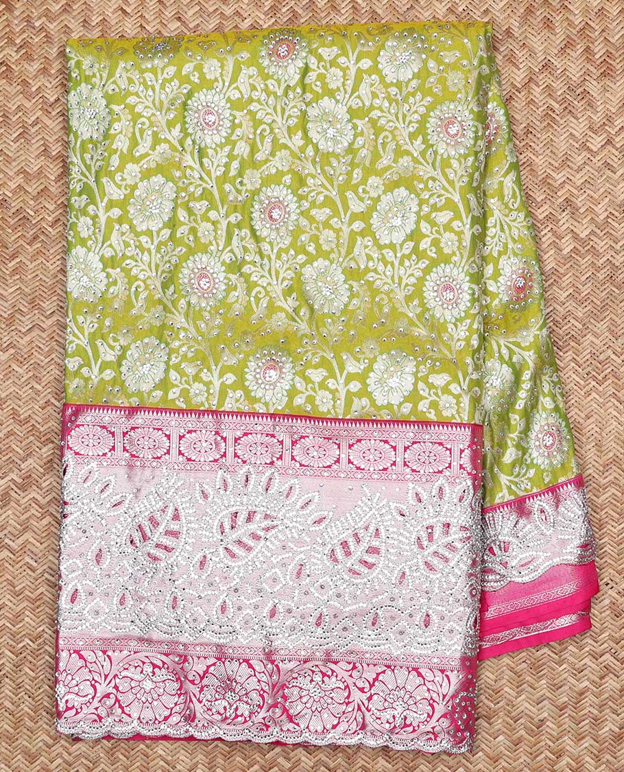 Leaf green silksaree with floral-jaal jacquard, contrast cut work border & pallu of argyle design, all-over stonework