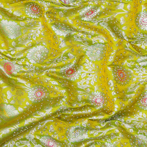 Leaf green silksaree with floral-jaal jacquard, contrast cut work border & pallu of argyle design, all-over stonework