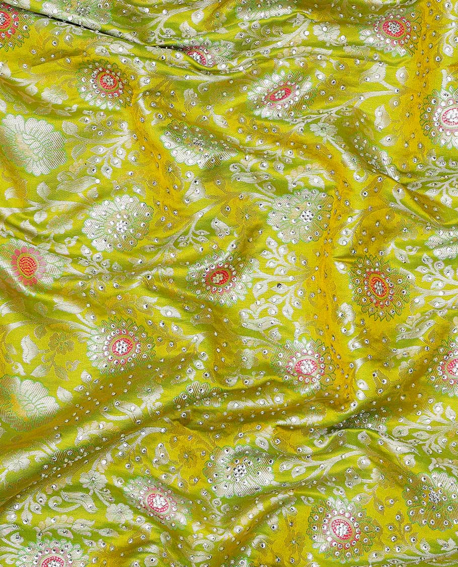 Leaf green silksaree with floral-jaal jacquard, contrast cut work border & pallu of argyle design, all-over stonework