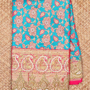 Sky blue floral-jaal jacquard vastrakala silksaree, contrast paisley border & pallu of ogee pattern, all-over stonework
