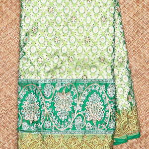 Green ogee jacquard silk saree with stonework,contrast stone & cutwork border & stonework pallu of jaal & paisley