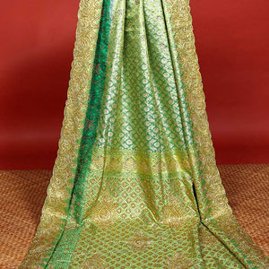 Green ogee jacquard silk saree with stonework,contrast stone & cutwork border & stonework pallu of jaal & paisley