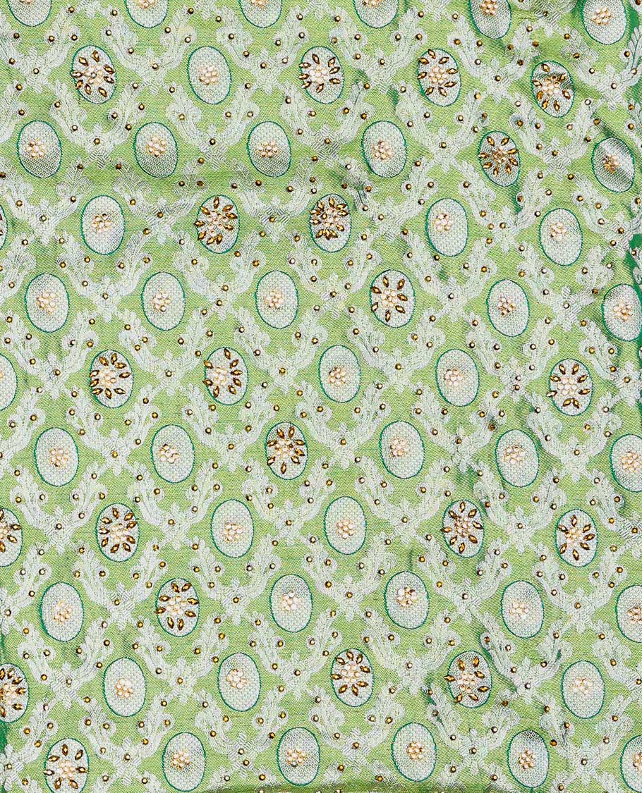 Green ogee jacquard silk saree with stonework,contrast stone & cutwork border & stonework pallu of jaal & paisley