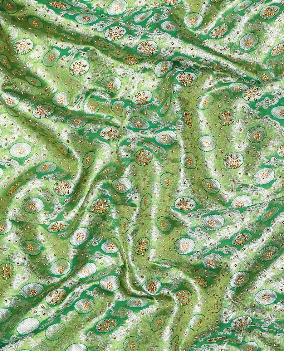 Green ogee jacquard silk saree with stonework,contrast stone & cutwork border & stonework pallu of jaal & paisley