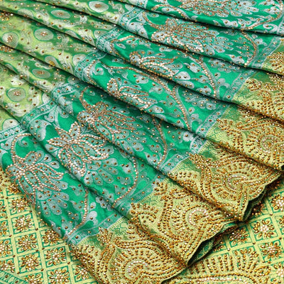 Green ogee jacquard silk saree with stonework,contrast stone & cutwork border & stonework pallu of jaal & paisley