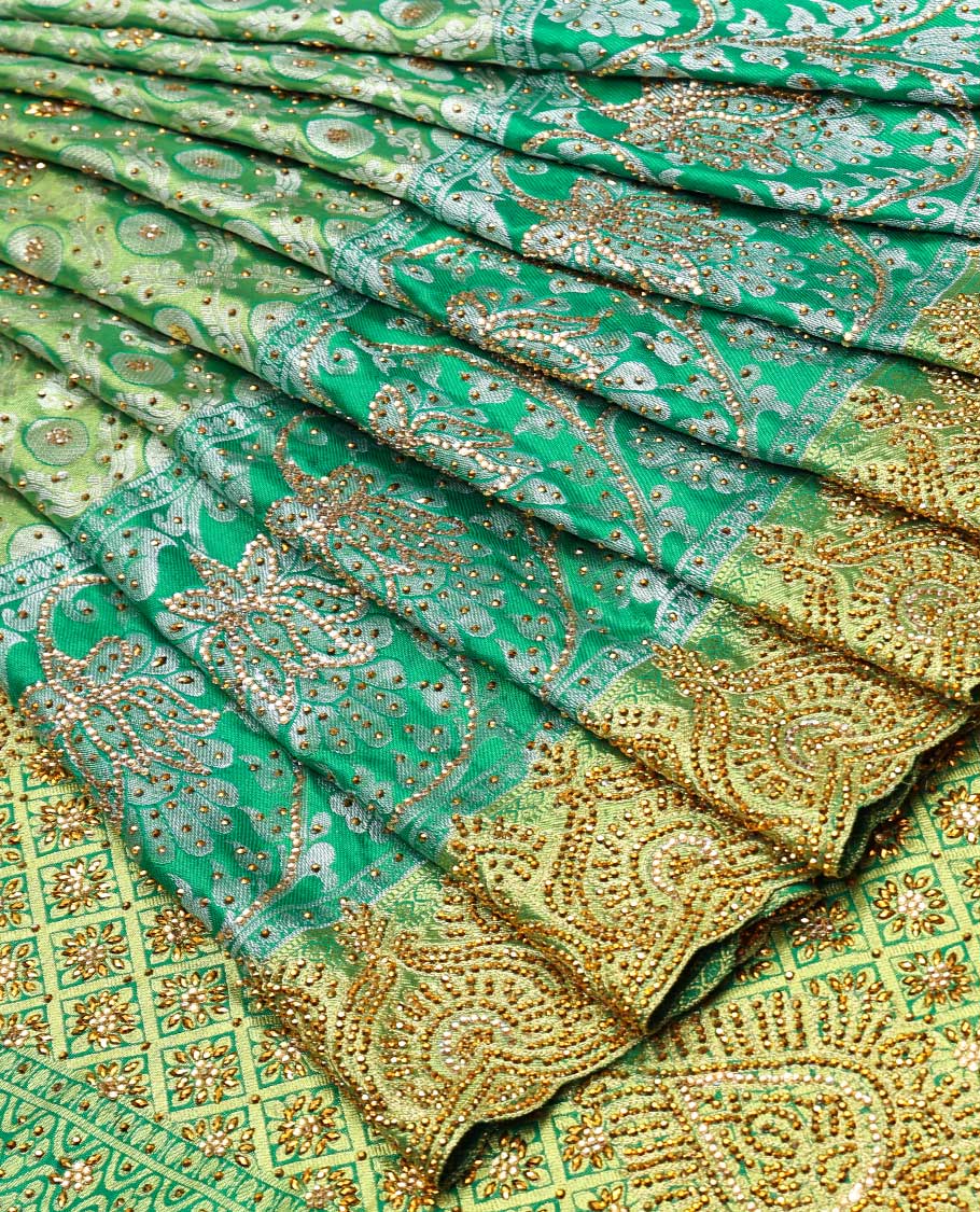 Green ogee jacquard silk saree with stonework,contrast stone & cutwork border & stonework pallu of jaal & paisley