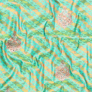 Green embossed vastrakala silksaree with ogee patterns & stonework, contrast cutwork border & intricate stonework pallu