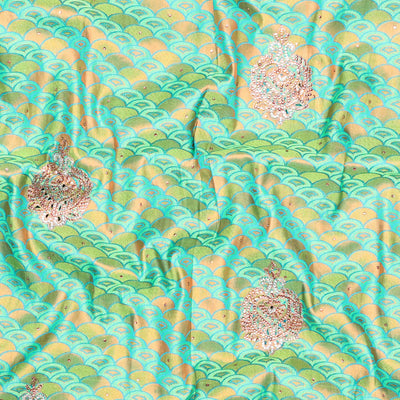 Green embossed vastrakala silksaree with ogee patterns & stonework, contrast cutwork border & intricate stonework pallu
