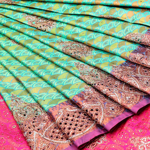 Green embossed vastrakala silksaree with ogee patterns & stonework, contrast cutwork border & intricate stonework pallu