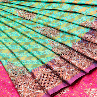 Green embossed vastrakala silksaree with ogee patterns & stonework, contrast cutwork border & intricate stonework pallu