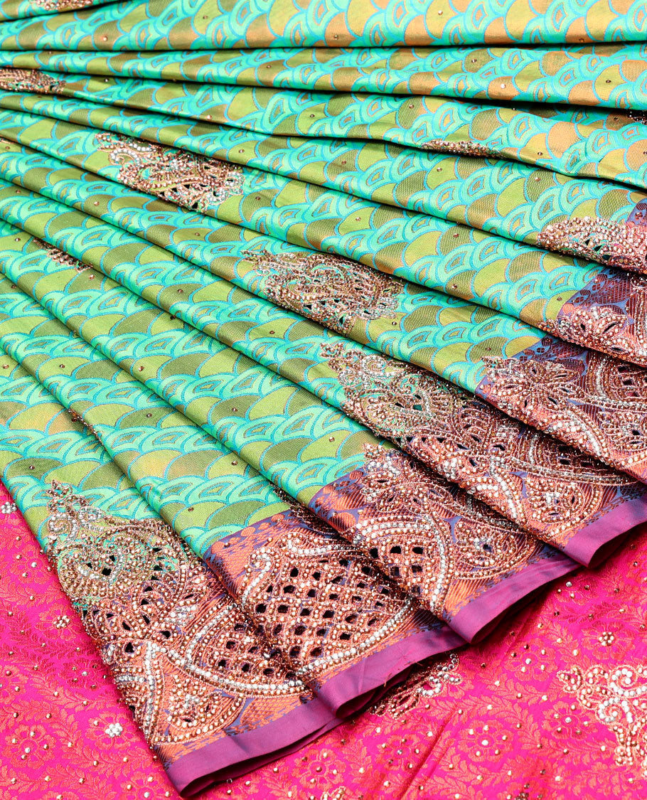 Green embossed vastrakala silksaree with ogee patterns & stonework, contrast cutwork border & intricate stonework pallu