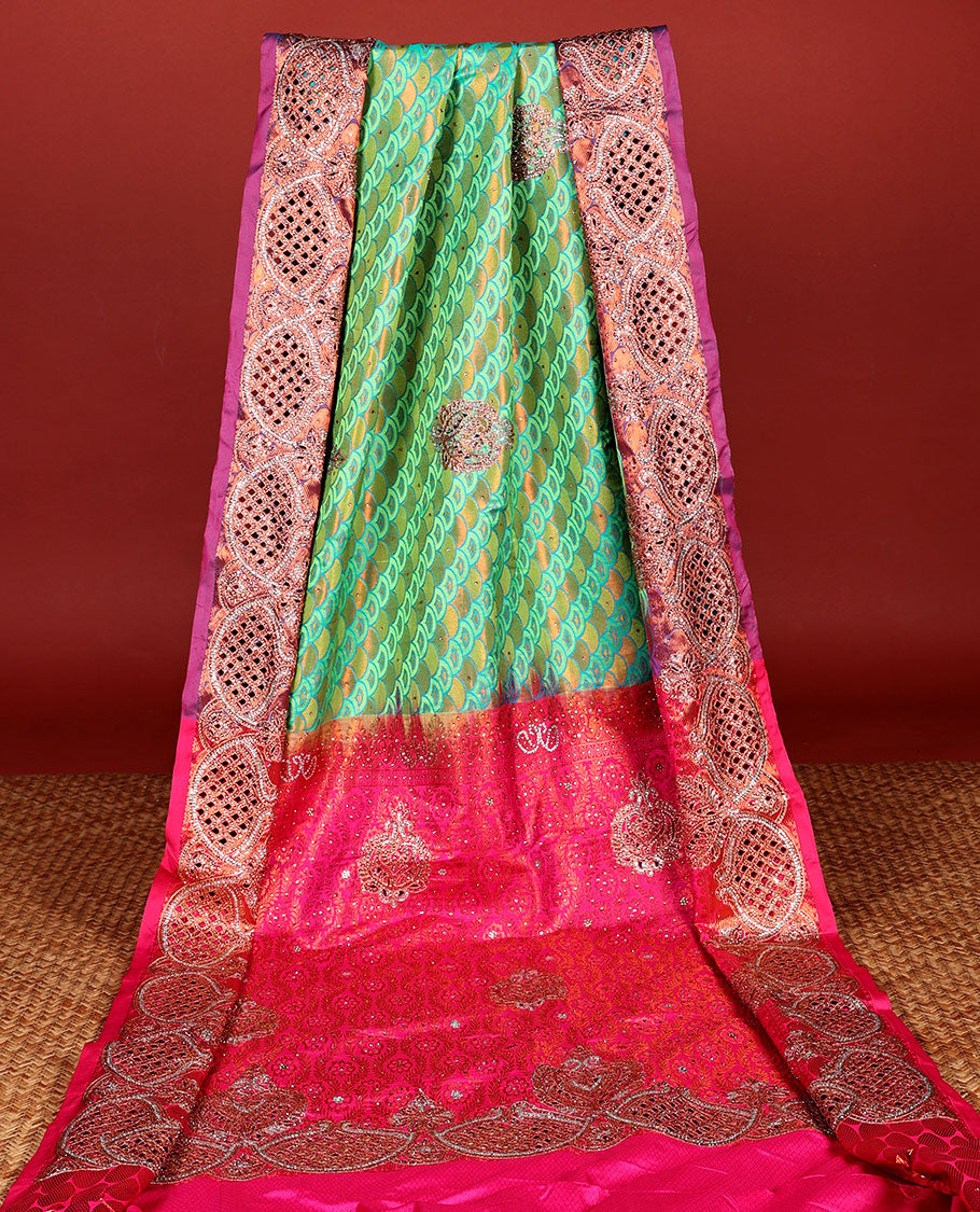 Green embossed vastrakala silksaree with ogee patterns & stonework, contrast cutwork border & intricate stonework pallu