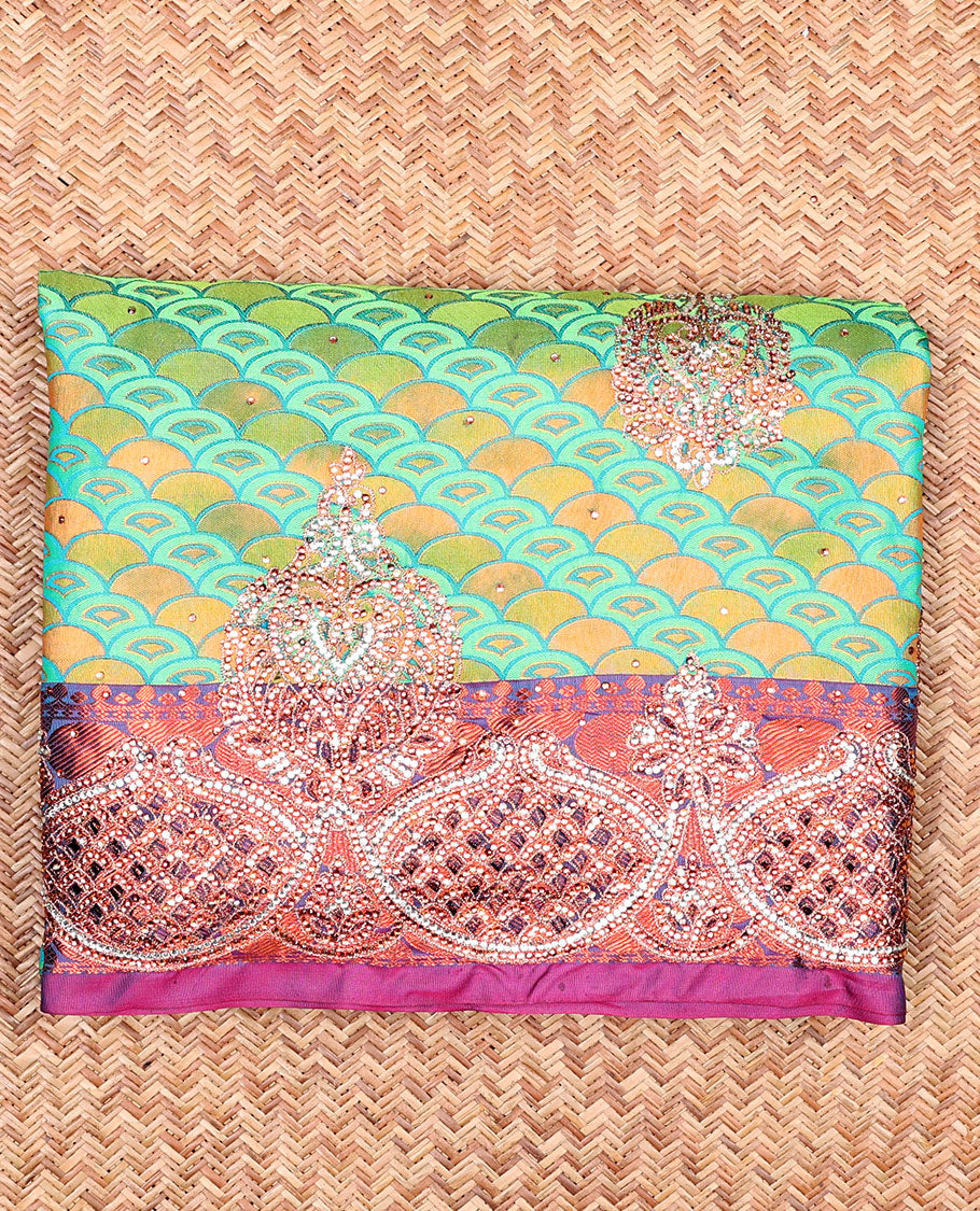 Green embossed vastrakala silksaree with ogee patterns & stonework, contrast cutwork border & intricate stonework pallu