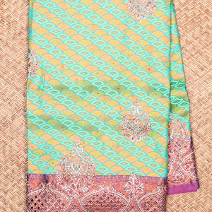 Green embossed vastrakala silksaree with ogee patterns & stonework, contrast cutwork border & intricate stonework pallu