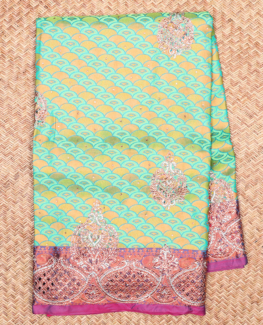 Green embossed vastrakala silksaree with ogee patterns & stonework, contrast cutwork border & intricate stonework pallu