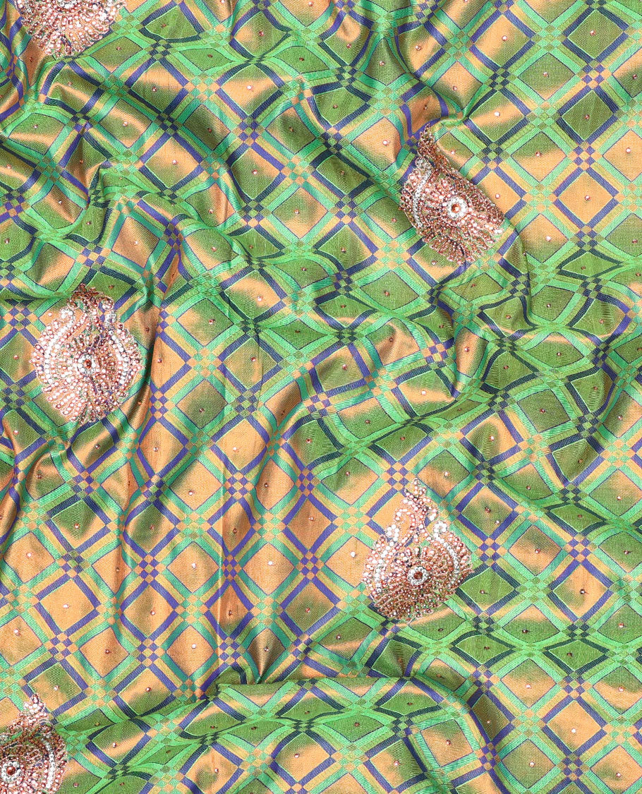 Green jacquard Vastrakala silksaree with stonework buttas, contrast cutwork border & intricate stonework pallu