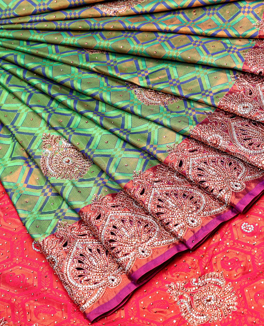 Green jacquard Vastrakala silksaree with stonework buttas, contrast cutwork border & intricate stonework pallu
