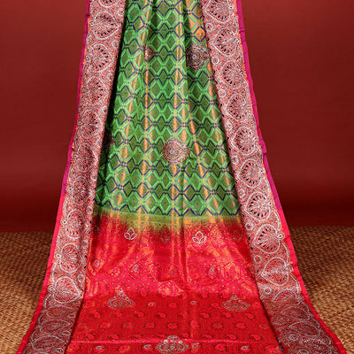 Green jacquard Vastrakala silksaree with stonework buttas, contrast cutwork border & intricate stonework pallu