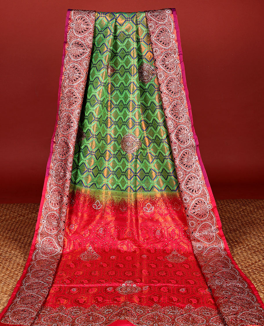 Green jacquard Vastrakala silksaree with stonework buttas, contrast cutwork border & intricate stonework pallu