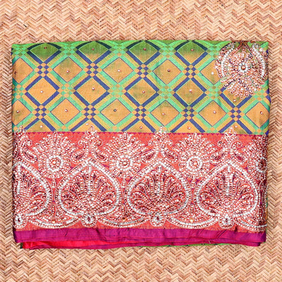 Green jacquard Vastrakala silksaree with stonework buttas, contrast cutwork border & intricate stonework pallu