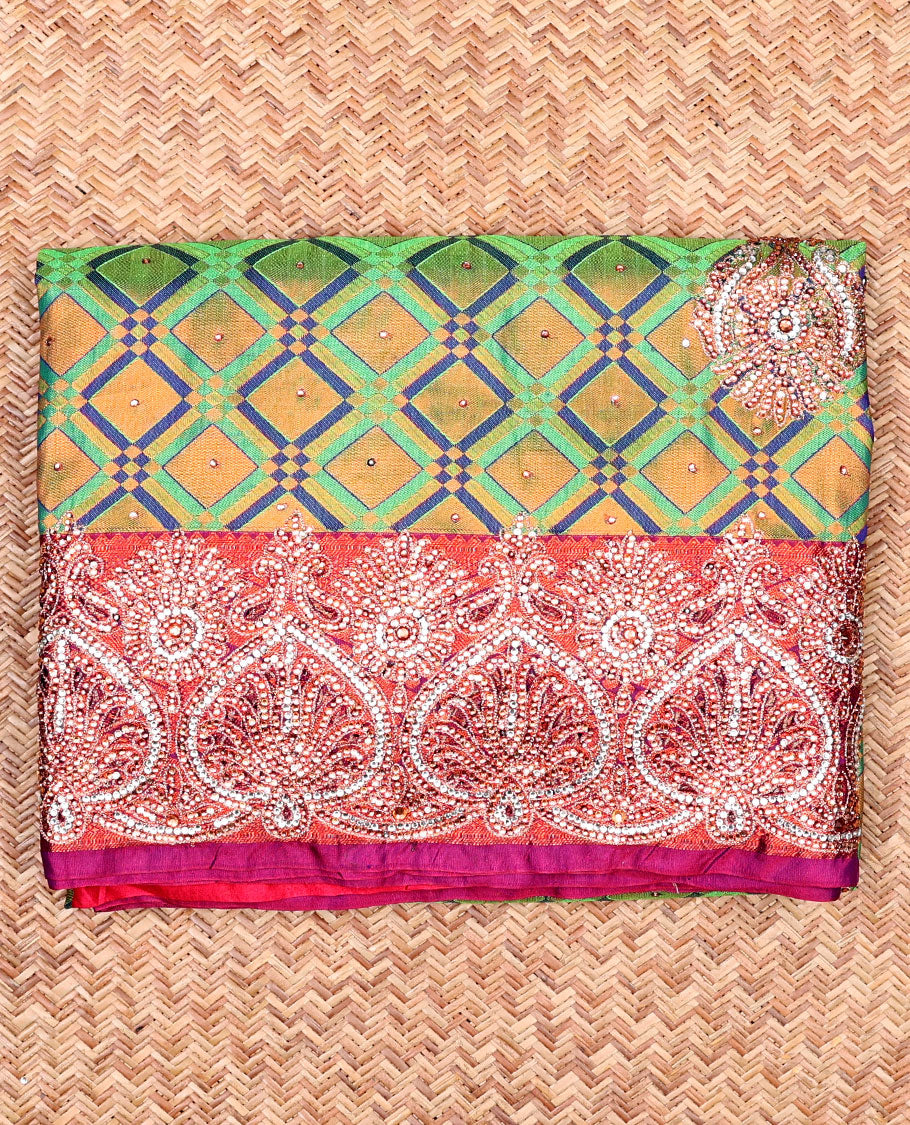Green jacquard Vastrakala silksaree with stonework buttas, contrast cutwork border & intricate stonework pallu