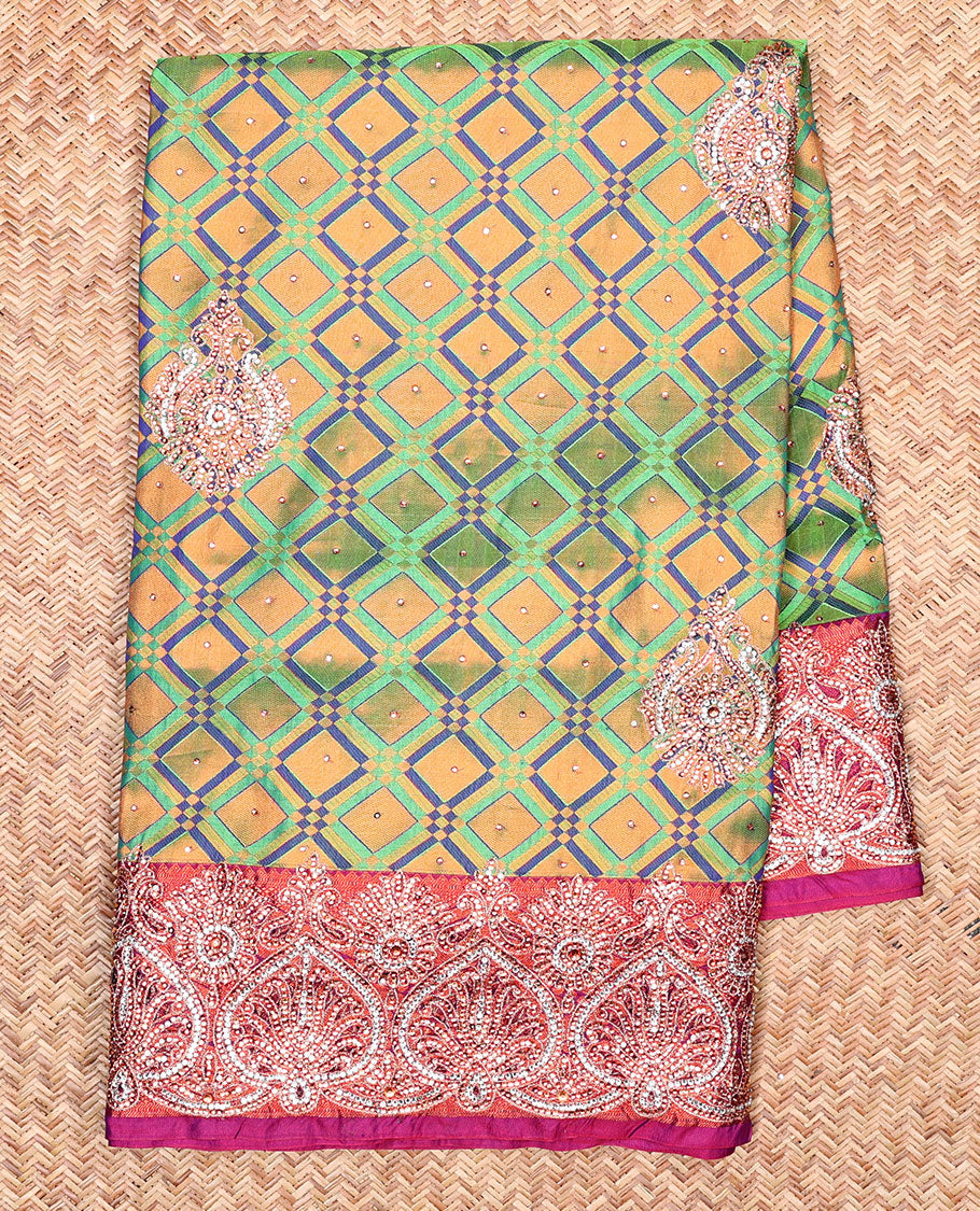 Green jacquard Vastrakala silksaree with stonework buttas, contrast cutwork border & intricate stonework pallu