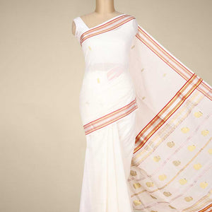 Cream kerala saree with zari buttas on its body, zari border & pallu features peacock designs