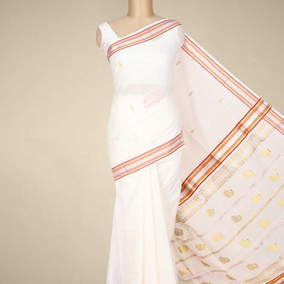 Cream kerala saree with zari buttas on its body, zari border & pallu features peacock designs