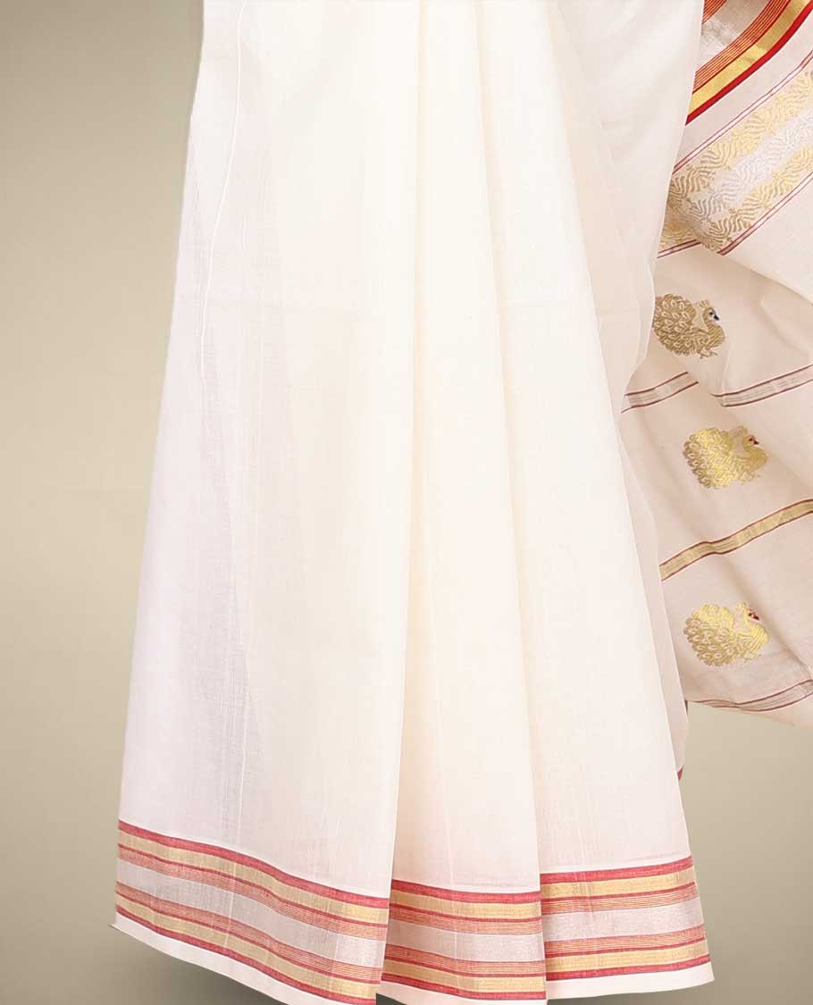 Cream kerala saree with zari buttas on its body, zari border & pallu features peacock designs