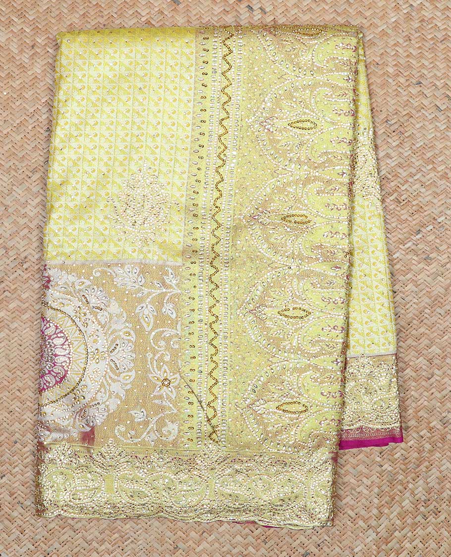 Lemon yellow jacquard & stonework vastrakala silksaree, contrast zari & stonework border & intricate stonework pallu