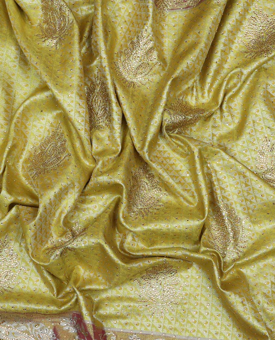 Lemon yellow jacquard & stonework vastrakala silksaree, contrast zari & stonework border & intricate stonework pallu