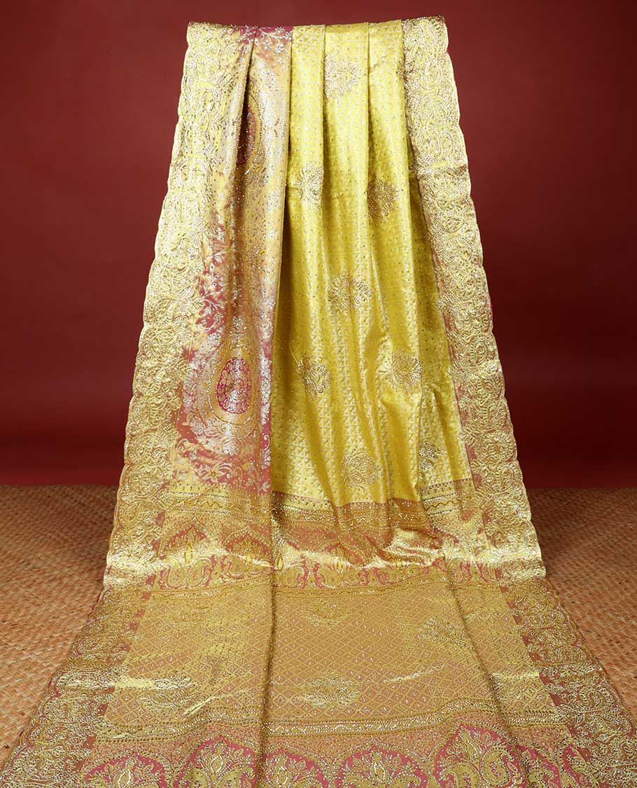 Lemon yellow jacquard & stonework vastrakala silksaree, contrast zari & stonework border & intricate stonework pallu