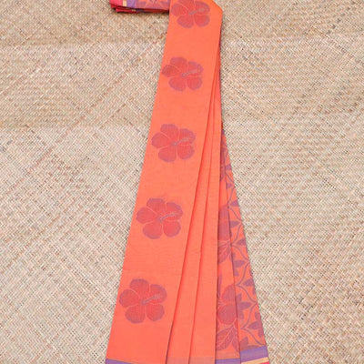 Lite orange kota saree with flower buttas, contrast thin border & intricate floral vine pallu