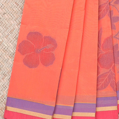 Lite orange kota saree with flower buttas, contrast thin border & intricate floral vine pallu