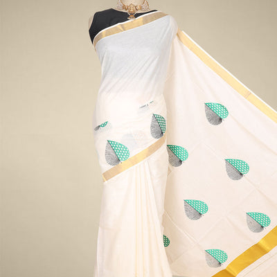 Cream kerala saree features thread embroidered leaf designs all over its body & pallu, zari border