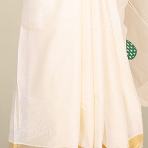 Cream kerala saree features thread embroidered leaf designs all over its body & pallu, zari border